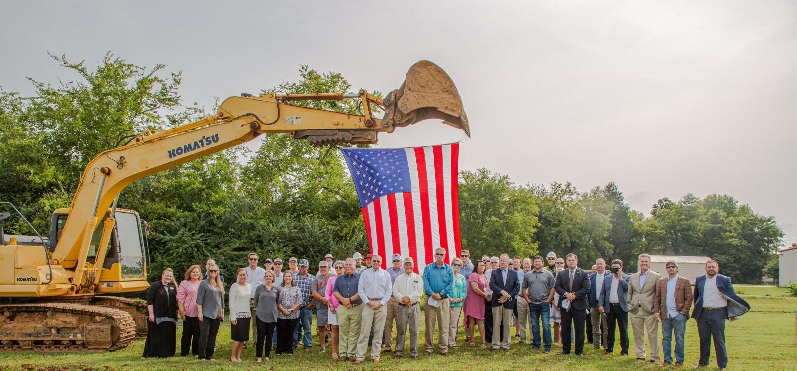 Hazel Green Alabama groundbreaking ceremony with American Flag in the background